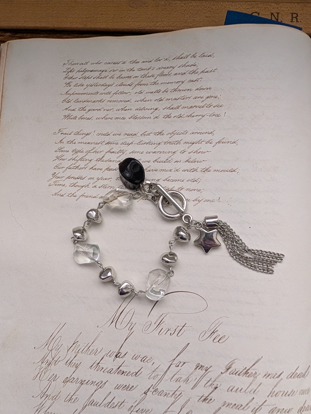 Silvertone Chain Bracelet with Clear Beads and Black Accent